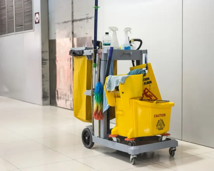 Janitor mopping floor in office building