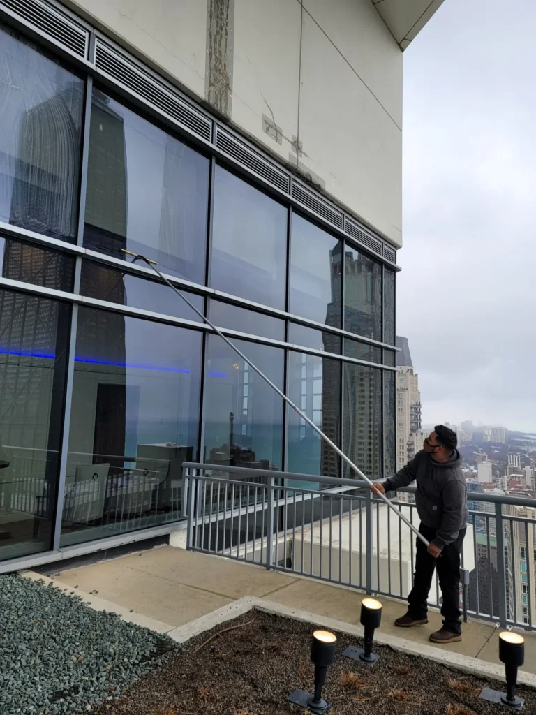 Window Cleaning Glass panels cleaned by technician inside a lobby